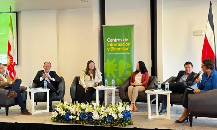 Panel discussion at Dole event in Costa Rica on expanding agricultural worker support through public-private partnerships.