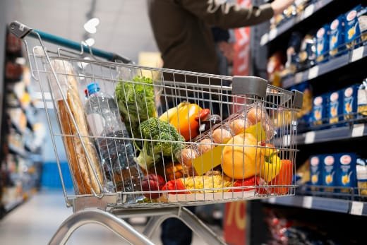 Strategies include meal planning, buying private-label brands, using digital coupons, and learning to make staples at home to reduce spending.