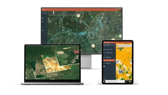 Desktop monitor, laptop, and tablet displaying colorful geospatial maps in a GIS app.